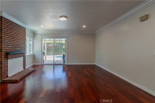 Empty room, Fireplace, Interior, Recessed Lighting, Stone Walls, Wood Texture Flooring