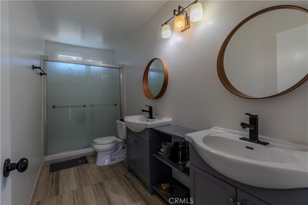 Bathroom, Dual Sink Vanities, Glass Shower, Interior, Wood Texture Flooring