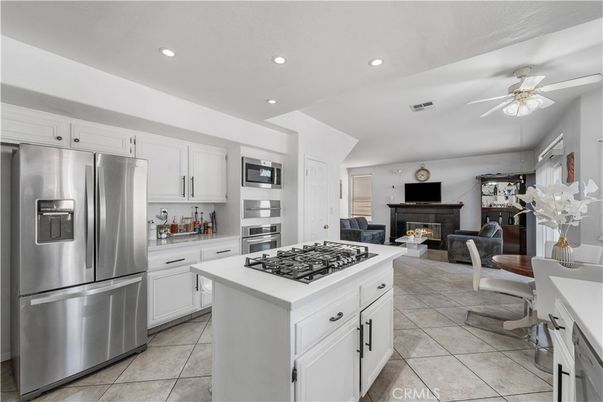 Dining room, Fireplace, Interior, Kitchen, Recessed Lighting, Stainless Steel Appliances