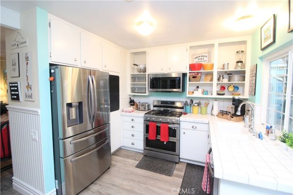 Interior, Kitchen, Stainless Steel Appliances, Tile Countertops, Wood Texture Flooring