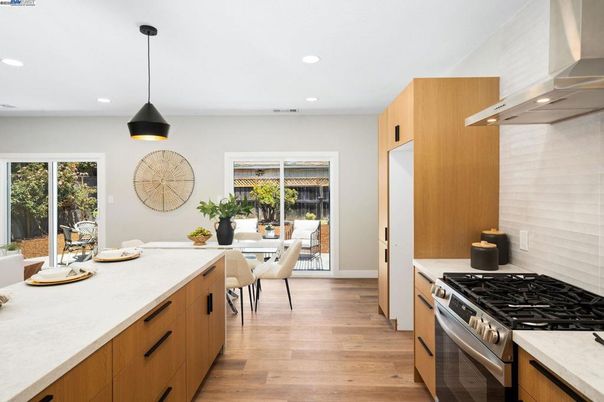 Dining room, Interior, Kitchen, Pendant Lights, Recessed Lighting, Stainless Steel Appliances, Wood Texture Flooring