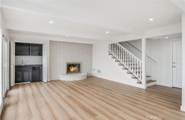 Empty room, Fireplace, Interior, Recessed Lighting, Stone Walls, Wood Texture Flooring