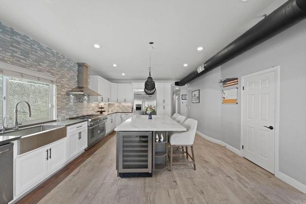 Interior, Kitchen, Pendant Lights, Recessed Lighting, Stainless Steel Appliances, Stone Walls, Wood Texture Flooring