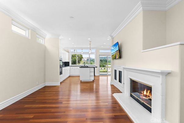 Empty room, Fireplace, Interior, Kitchen, Pendant Lights, Recessed Lighting, Wood Texture Flooring