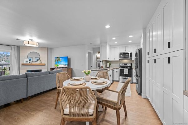 Dining room, Interior, Kitchen, Living room, Recessed Lighting, Stainless Steel Appliances, Wood Texture Flooring