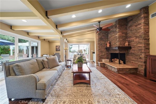 Fireplace, Interior, Living room, Recessed Lighting, Stone Walls, Wood Texture Flooring