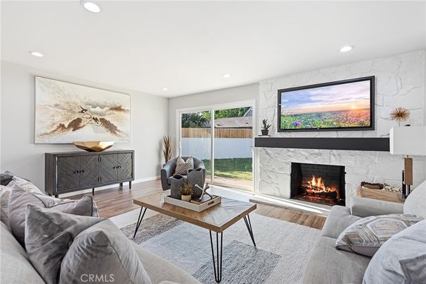 Fireplace, Interior, Living room, Marble Walls, Recessed Lighting, Wood Texture Flooring
