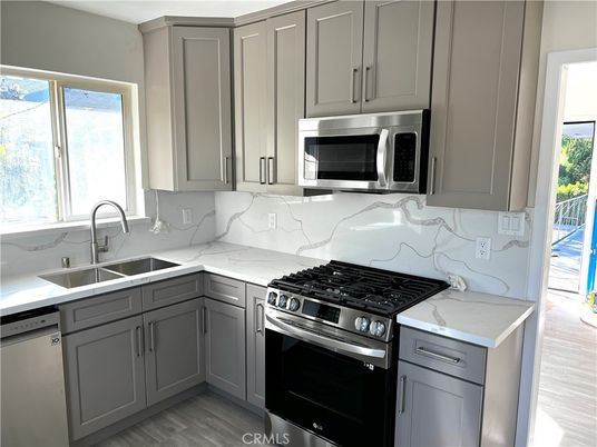 Interior, Kitchen, Marble Walls, Stainless Steel Appliances, Wood Texture Flooring