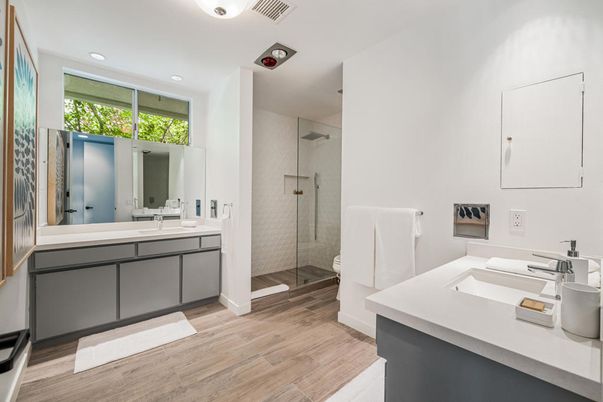 Bathroom, Dual Sink Vanities, Glass Shower, Interior, Recessed Lighting, Wood Texture Flooring