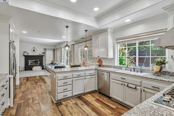 Fireplace, Interior, Kitchen, Pendant Lights, Recessed Lighting, Stainless Steel Appliances, Wood Texture Flooring