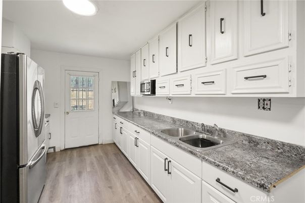 Interior, Kitchen, Recessed Lighting, Washer, Wood Texture Flooring