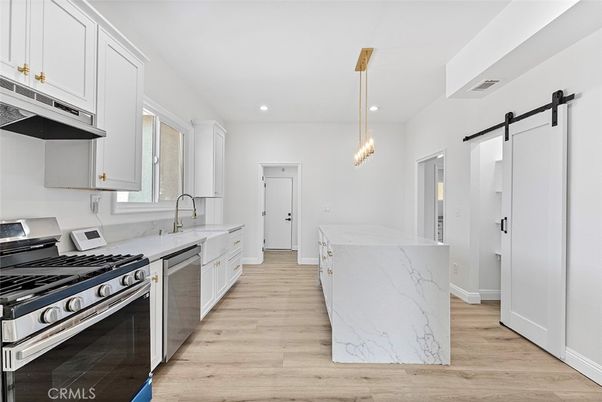 Interior, Kitchen, Pendant Lights, Recessed Lighting, Stainless Steel Appliances, Wood Texture Flooring