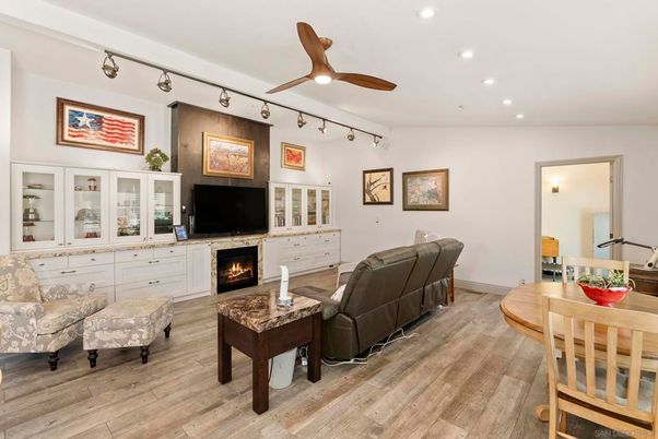 Dining room, Fireplace, Interior, Living room, Recessed Lighting, Wood Texture Flooring