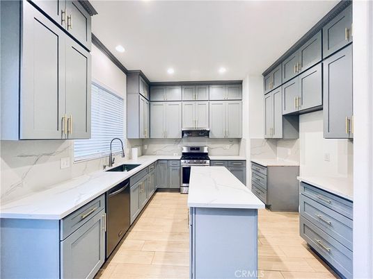 Interior, Kitchen, Marble Walls, Recessed Lighting, Stainless Steel Appliances, Wood Texture Flooring