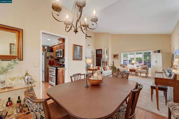 Chandelier, Dining room, Interior, Kitchen, Living room, Stainless Steel Appliances, Wood Texture Flooring