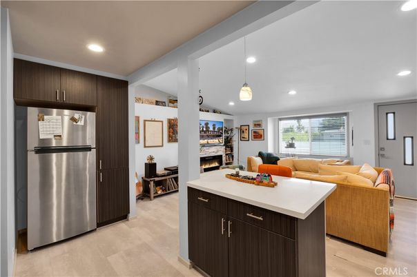 Fireplace, Interior, Kitchen, Living room, Pendant Lights, Recessed Lighting, Stainless Steel Appliances, Wood Texture Flooring