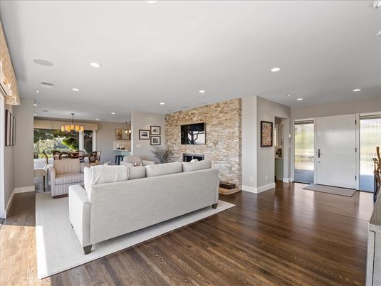 Dining room, Fireplace, Interior, Living room, Pendant Lights, Recessed Lighting, Stone Walls, Wood Texture Flooring