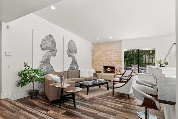 Fireplace, Interior, Living room, Recessed Lighting, Stone Walls, Wood Texture Flooring