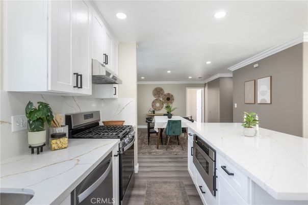 Dining room, Interior, Kitchen, Recessed Lighting, Stainless Steel Appliances, Wood Texture Flooring