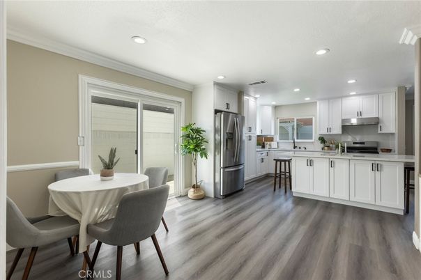 Dining room, Interior, Kitchen, Recessed Lighting, Stainless Steel Appliances, Wood Texture Flooring