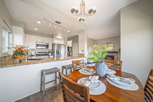 Dining room, Interior, Kitchen, Pendant Lights, Recessed Lighting, Stainless Steel Appliances, Wood Texture Flooring