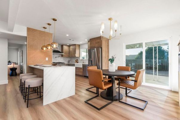 Dining room, Interior, Kitchen, Marble Walls, Pendant Lights, Recessed Lighting, Stainless Steel Appliances, Wood Texture Flooring