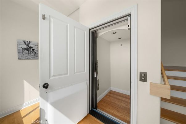 Elevator, Interior, Recessed Lighting, Wood Texture Flooring