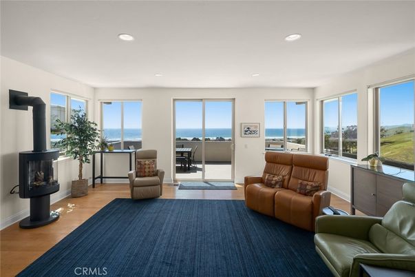Fireplace, Interior, Living room, Recessed Lighting, Water, Wood Texture Flooring