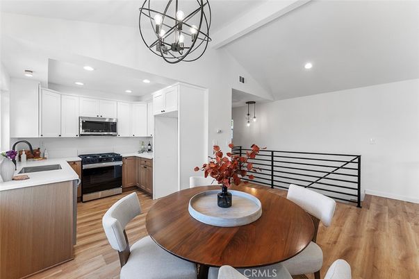 Chandelier, Dining room, Interior, Kitchen, Pendant Lights, Recessed Lighting, Stainless Steel Appliances, Wood Texture Flooring