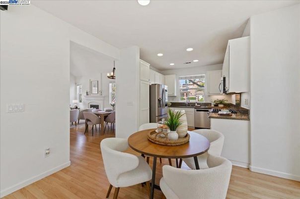 Dining room, Interior, Kitchen, Pendant Lights, Recessed Lighting, Stainless Steel Appliances, Wood Texture Flooring