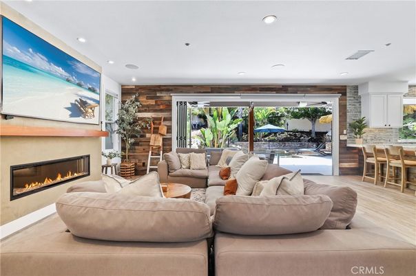 Dining room, Fireplace, Interior, Living room, Recessed Lighting, Stone Walls, Wood Texture Flooring, Wooden Walls
