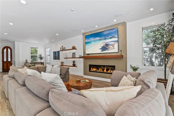 Dining room, Fireplace, Interior, Living room, Recessed Lighting, Wood Texture Flooring