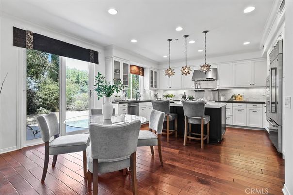 Dining room, Interior, Kitchen, Pendant Lights, Recessed Lighting, Stainless Steel Appliances, Wood Texture Flooring