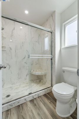 Bathroom, Glass Shower, Interior, Marble Walls, Recessed Lighting, Wood Texture Flooring