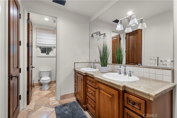 Bathroom, Dual Sink Vanities, Interior, Recessed Lighting, Tile Countertops