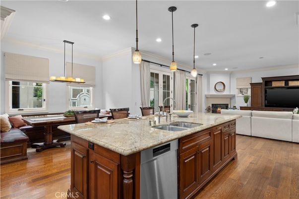 Dining room, Fireplace, Interior, Kitchen, Living room, Pendant Lights, Recessed Lighting, Stainless Steel Appliances, Wood Texture Flooring