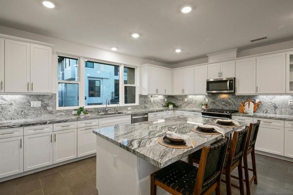 Interior, Kitchen, Marble Walls, Recessed Lighting, Stainless Steel Appliances