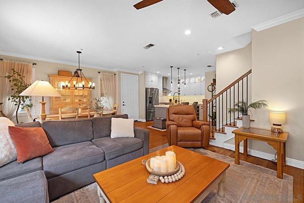Chandelier, Dining room, Interior, Kitchen, Living room, Pendant Lights, Recessed Lighting, Stainless Steel Appliances, Wood Texture Flooring