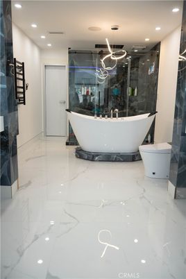 Bathroom, Free Standing Baths, Glass Shower, Interior, Marble, Marble Walls, Pendant Lights, Recessed Lighting