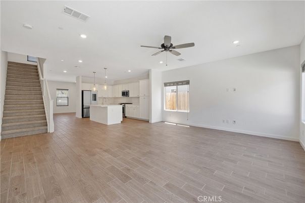 Empty room, Interior, Kitchen, Pendant Lights, Recessed Lighting, Stainless Steel Appliances, Wood Texture Flooring