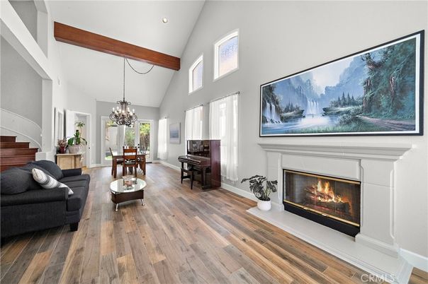 Chandelier, Dining room, Fireplace, Interior, Living room, Piano, Recessed Lighting, Wooden Beams, Wood Texture Flooring