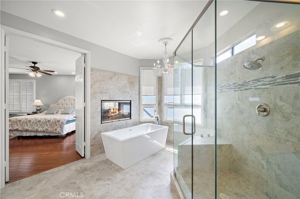 Bathroom, Bedroom, Chandelier, Fireplace, Free Standing Baths, Glass Shower, Interior, Living room, Recessed Lighting, Wood Texture Flooring
