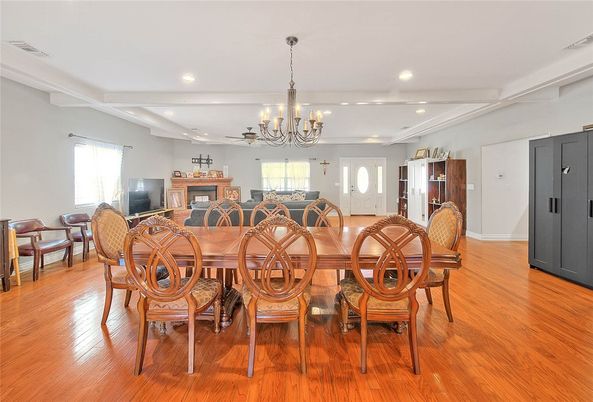 Chandelier, Dining room, Fireplace, Interior, Recessed Lighting, Wood Texture Flooring
