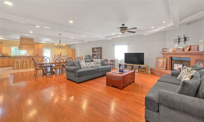 Chandelier, Dining room, Fireplace, Interior, Living room, Recessed Lighting, Wood Texture Flooring