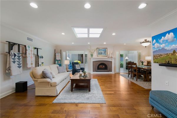 Dining room, Fireplace, Interior, Living room, Recessed Lighting, Wood Texture Flooring