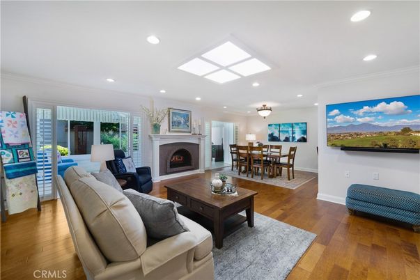 Dining room, Fireplace, Interior, Living room, Recessed Lighting, Wood Texture Flooring