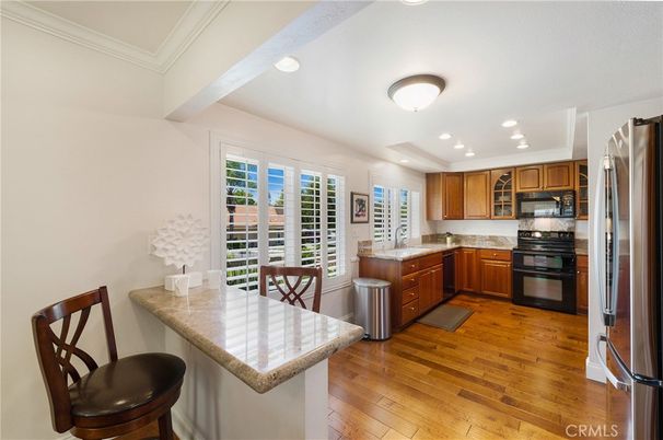 Dining room, Interior, Kitchen, Recessed Lighting, Stainless Steel Appliances, Wood Texture Flooring