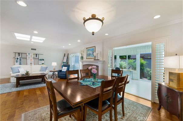 Dining room, Fireplace, Interior, Living room, Recessed Lighting, Wood Texture Flooring