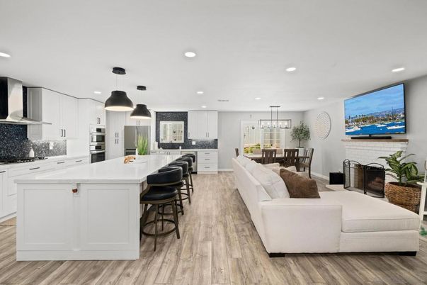 Dining room, Fireplace, Interior, Kitchen, Living room, Pendant Lights, Recessed Lighting, Stainless Steel Appliances, Wood Texture Flooring