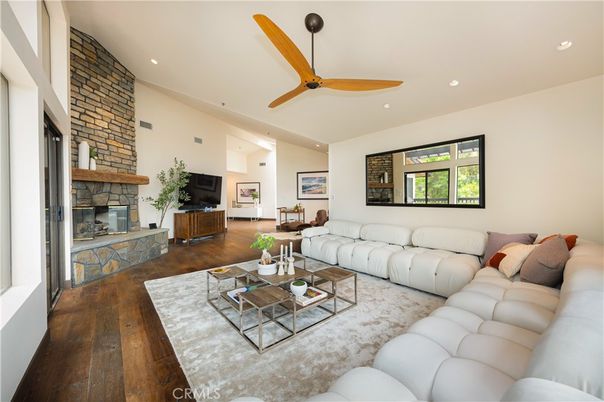 Fireplace, Interior, Living room, Recessed Lighting, Stone Walls, Wood Texture Flooring